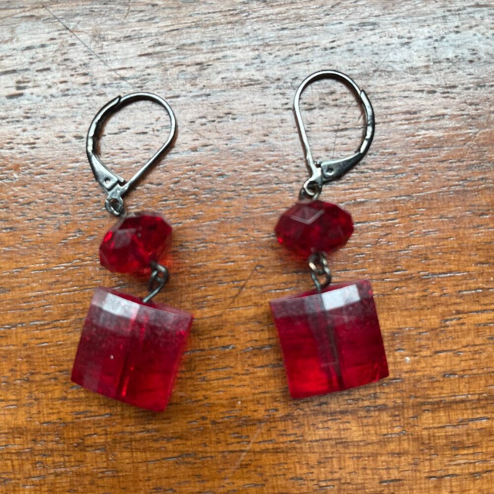 3/$12.  Red Plastic Dangle Earrings